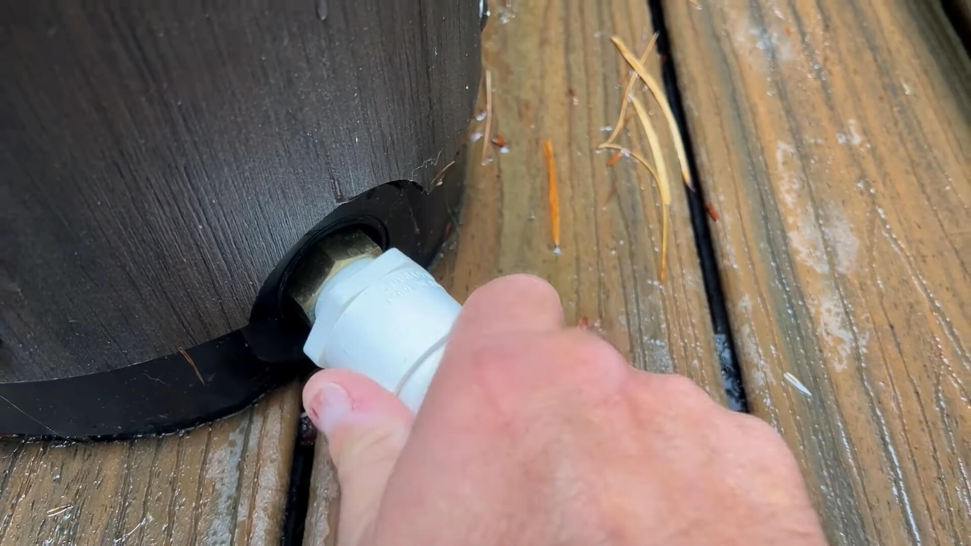 Attaching a hose for draining water from the hot tub